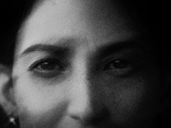 A close black-and-white portrait of an athlete's eyes